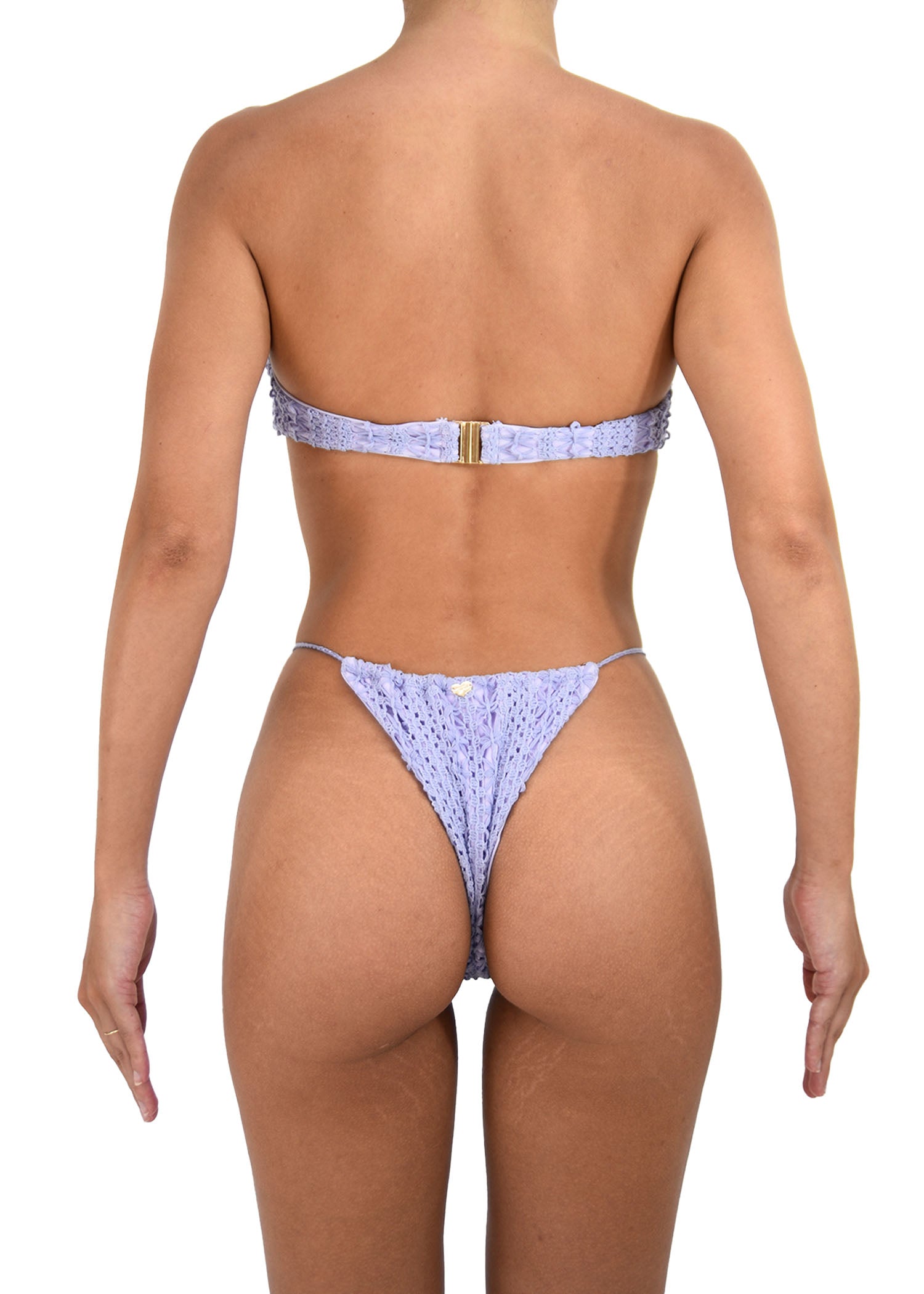 Back view of violet crochet bikini featuring its bottoms tie side and adjustable coverage.