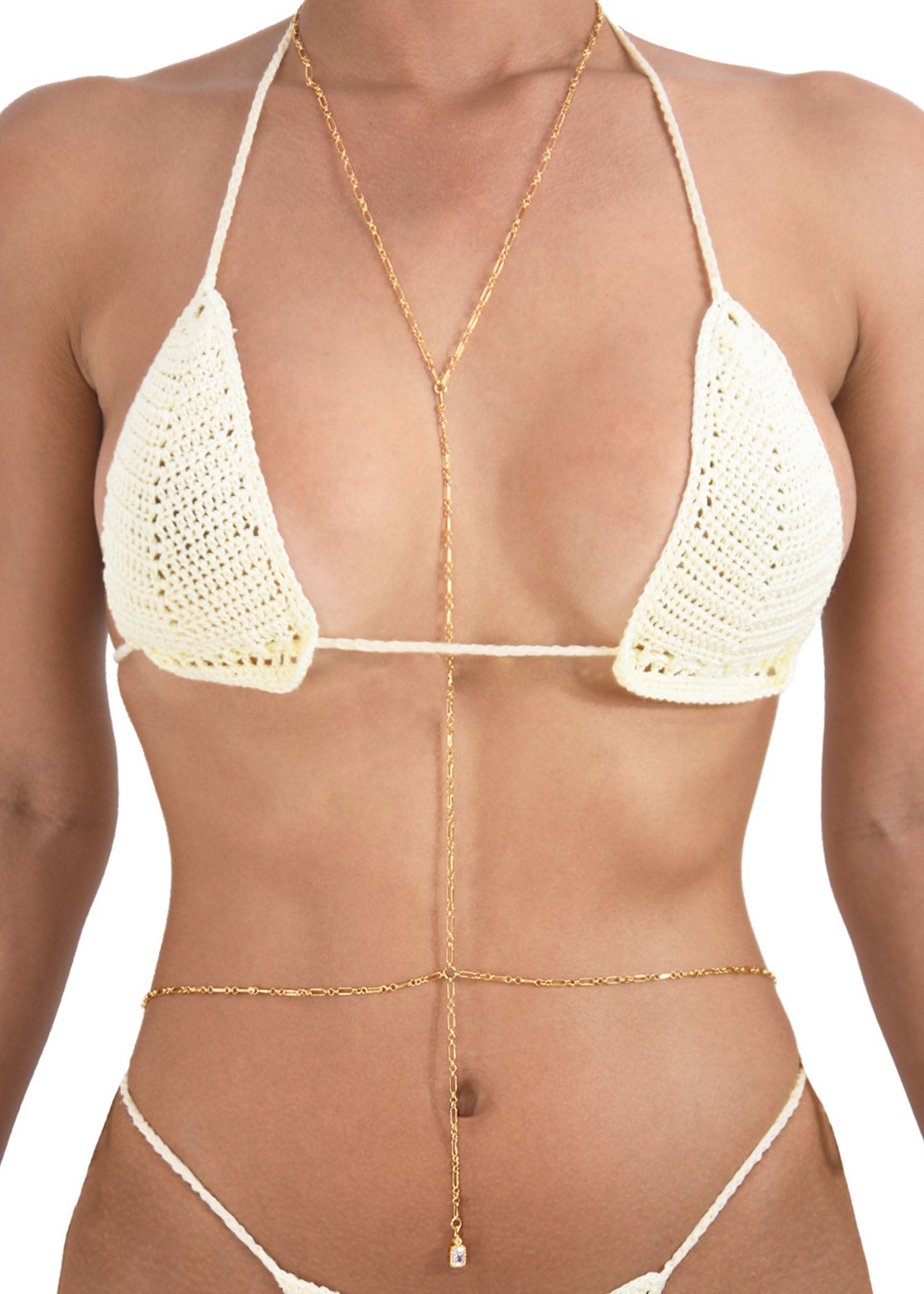 Close up of model wearing gold body chain featuring its 18k gold plated chain.