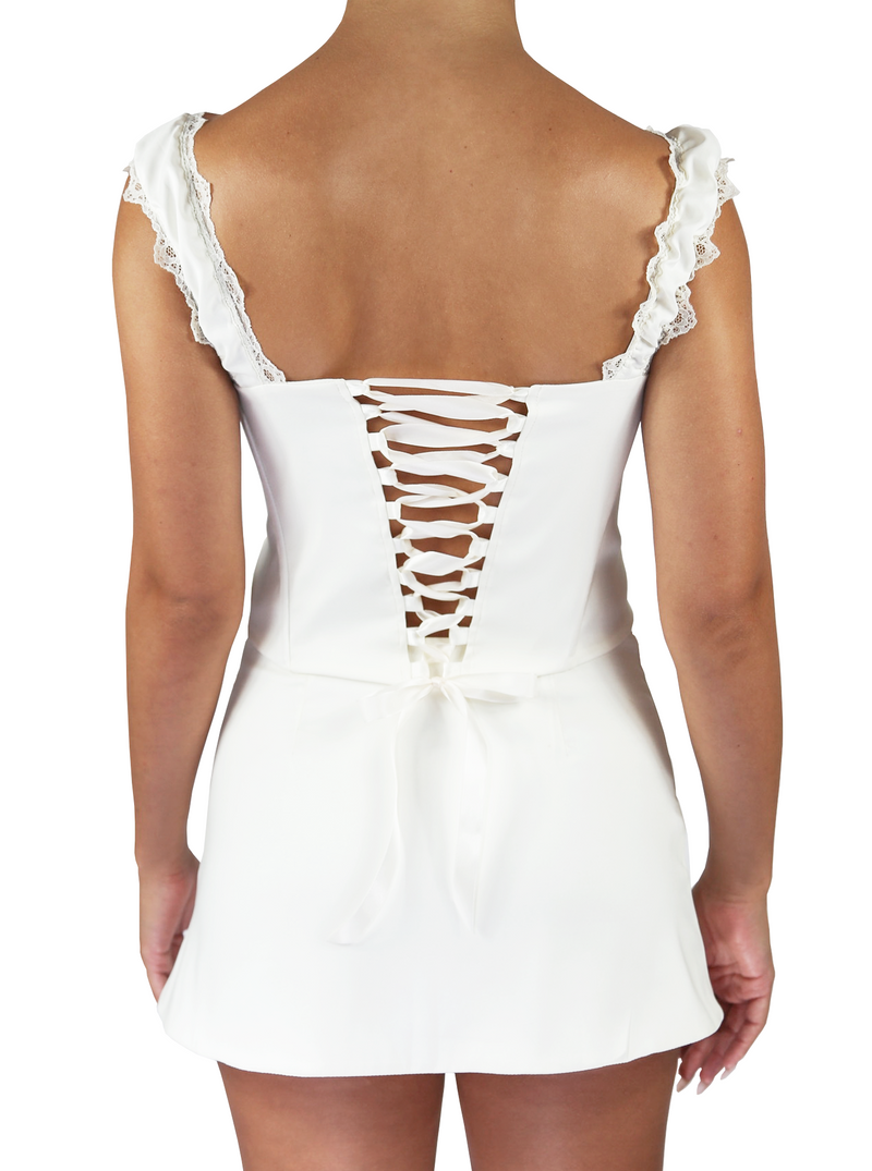 Back view of ivory corset with a ribbon lace-up back and lace trim shoulder straps. 