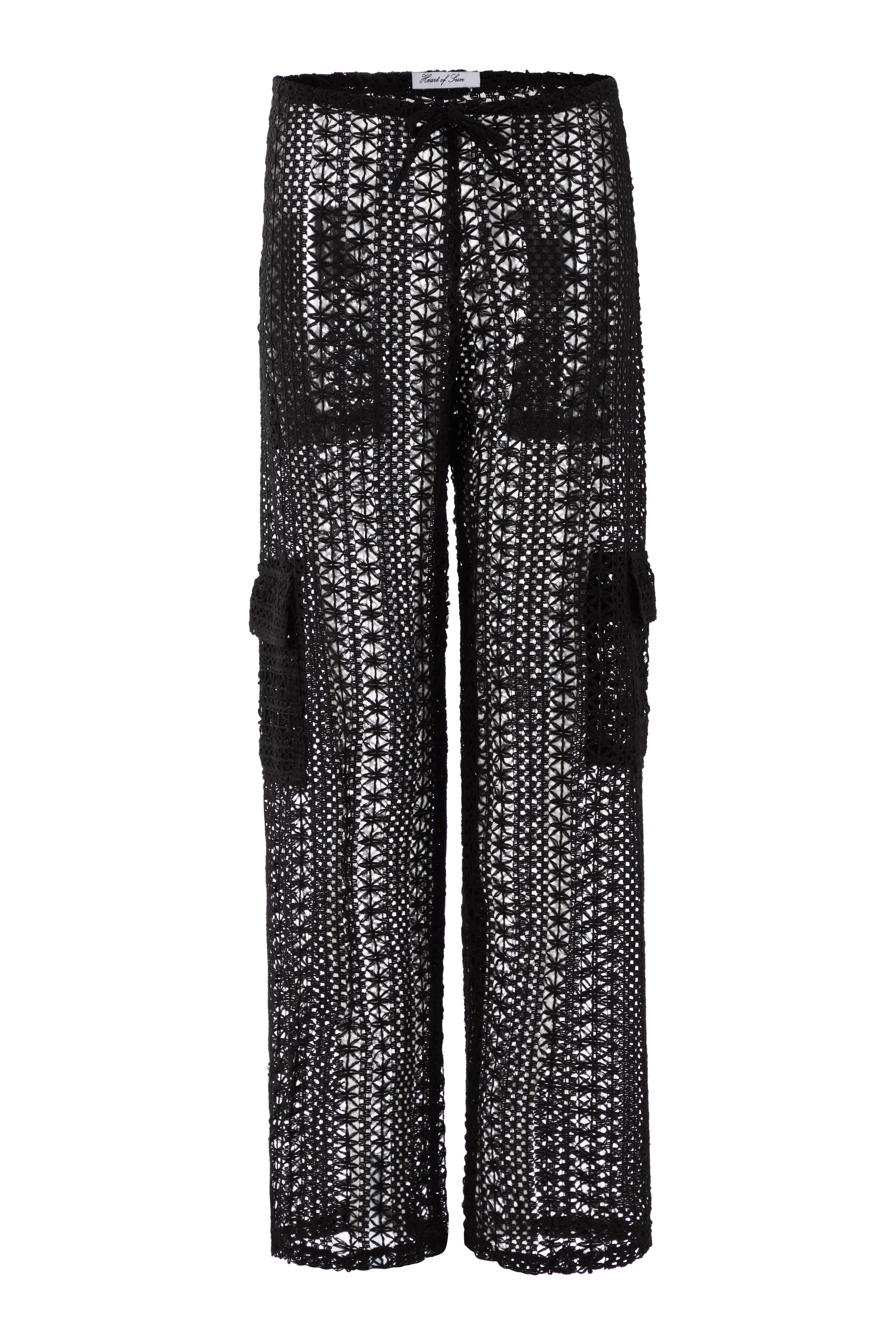 The front view of the Bahia cargo pants with two pockets on each side made from Heart of Sun's signature crochet in black. The legs are straight and slightly see-through.