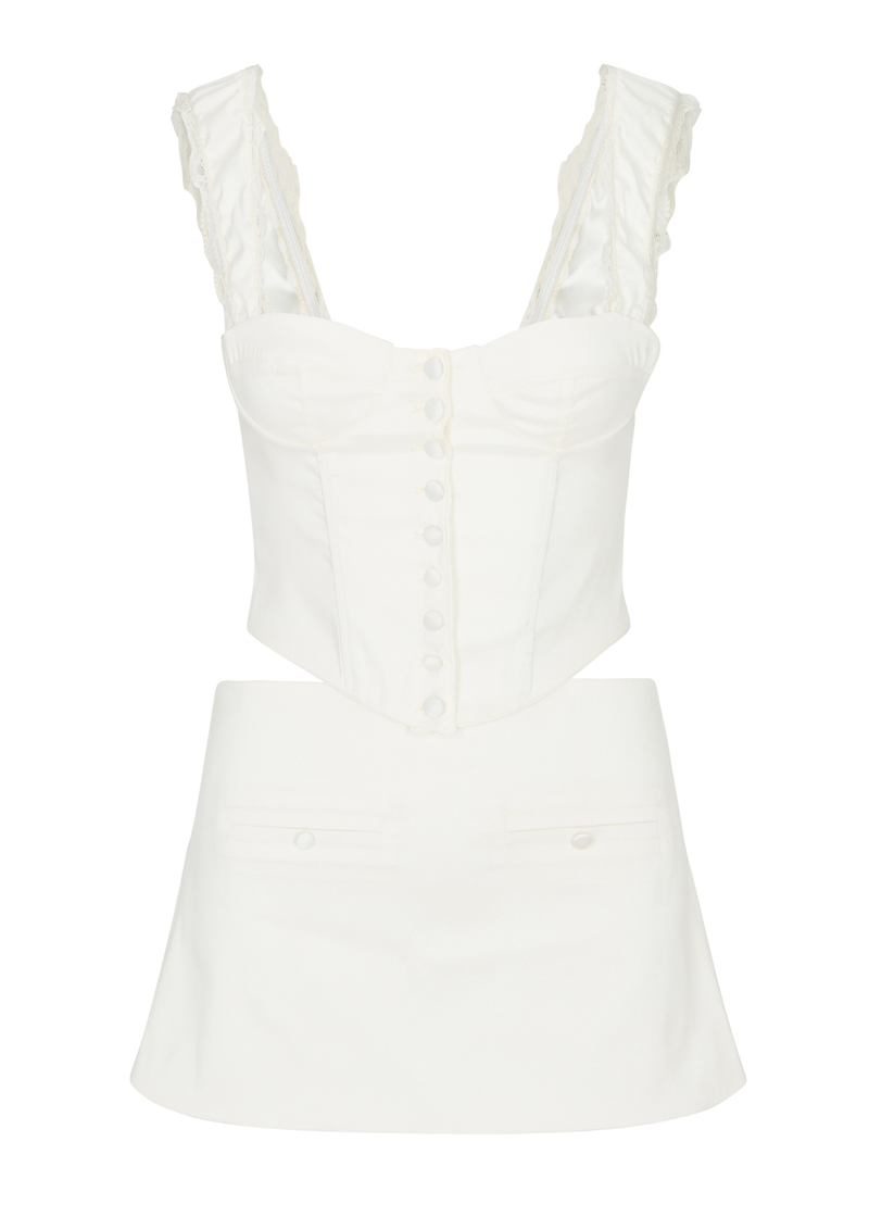 A ivory two-piece outfit featuring a lace-up corset top with lace trim and button details, paired with a mini skirt. 