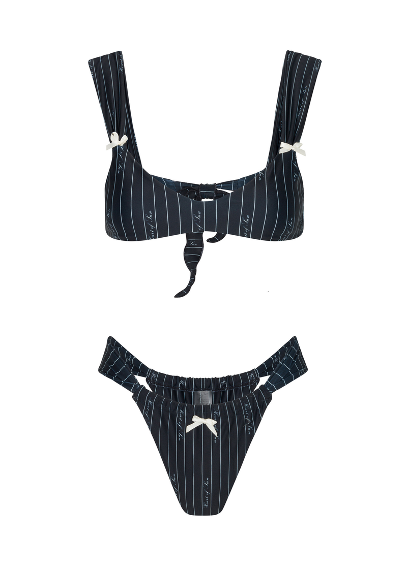 Le Soleil bralette-style top with thick shoulder straps and vintage-inspired bow details, designed in a chic pinstripe print for a confident swim look